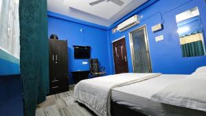 Ένα ή περισσότερα κρεβάτια σε δωμάτιο στο Banjara House n Cafe