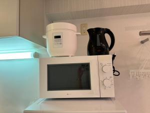 Kuchyň nebo kuchyňský kout v ubytování マルチステイ大阪天満 + 32 fotografií