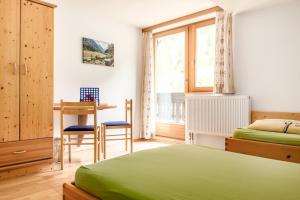 Ένα ή περισσότερα κρεβάτια σε δωμάτιο στο Voglbachhof