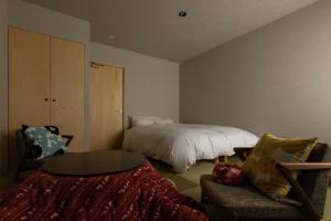 Letto o letti in una camera di 越中井波町屋旅館古香里庵