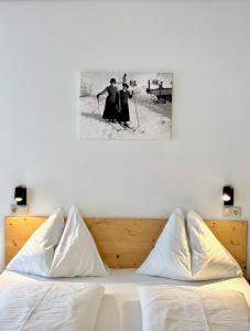 Postel nebo postele na pokoji v ubytování Haus Friedrichsburg - Bergbahnen von Mai bis November inklusive