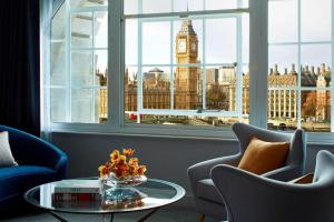 a living room with a view of big ben clock tower at London Marriott Hotel County Hall in London
