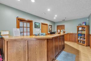 a large kitchen with a large wooden counter top at Grand Wood Suites - 2nd Floor Front Side Signature Suite 201 in Nashville
