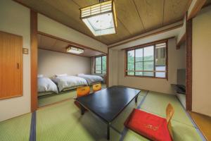 Krevet ili kreveti u jedinici u okviru objekta Takamiya Hotel Hammond