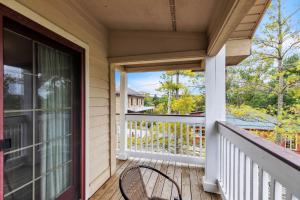 a porch with a chair and a window at Grand Wood Suites - 3rd Floor Front Side Corner Penthouse Suite 301 in Nashville