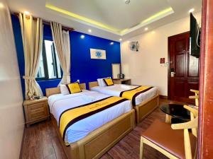 Postel nebo postele na pokoji v ubytování Hoàng Gia Hotel Côn Đảo