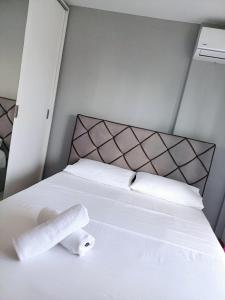 Ένα ή περισσότερα κρεβάτια σε δωμάτιο στο Les Sables Roses Appartement