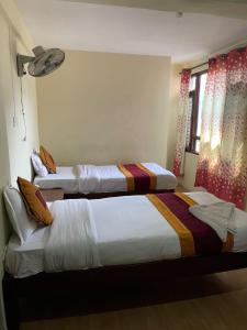 Postel nebo postele na pokoji v ubytování Holy Land Hotel Nepal