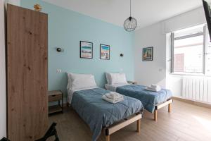 Postel nebo postele na pokoji v ubytování DOMINA Guest House