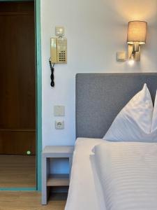 Postel nebo postele na pokoji v ubytování Haus Friedrichsburg - Bergbahnen von Mai bis November inklusive