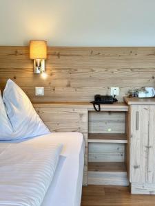 Postel nebo postele na pokoji v ubytování Haus Friedrichsburg - Bergbahnen von Mai bis November inklusive