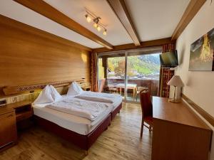 Postel nebo postele na pokoji v ubytování Haus Friedrichsburg - Bergbahnen von Mai bis November inklusive