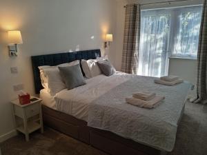 Postel nebo postele na pokoji v ubytování Hygga