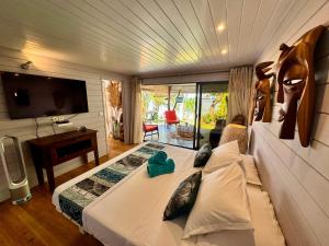 Postel nebo postele na pokoji v ubytování Fare One Island Moorea