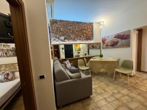 a living room with a couch and a table at Duomo View Apartment in Catania