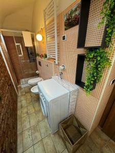 a bathroom with a sink and a toilet in a room at Duomo View Apartment in Catania +36 photos