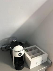 a coffee maker on a counter next to a box at PANORAMA APARTMENT in Montana +21 photos