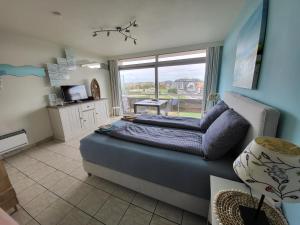 Posezení v ubytování Studio with sea view and panoramic view in Bredene