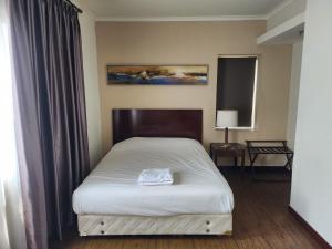 Ένα ή περισσότερα κρεβάτια σε δωμάτιο στο Hunian dekat T I Ancol, pintu Toll, Itc Mangga dua +1 φωτογραφίες