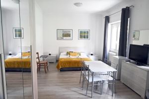 A bed or beds in a room at Appia Antica Guest House