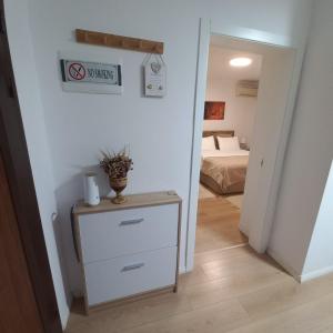 Postel nebo postele na pokoji v ubytování Regis Apartment