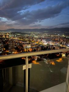 a view of a city at night at Skyview Sunlight Apartment 29th Floor in Skopje