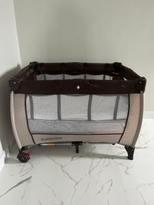 a suitcase sitting on a cart on a marble floor at Residencial ISL - Praia da Pinheira SC in Palhoça