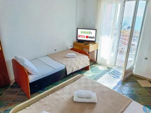 Llit o llits en una habitació de Amisos Apartmani