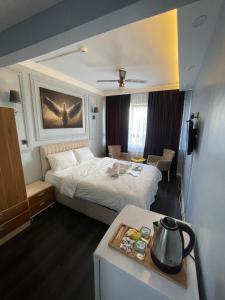 a hotel room with a bed and a table at Kıyı Butik Otel in Mimarsinan +96 photos