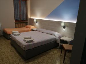 A bed or beds in a room at Cannone d'Oro