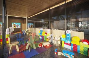 a childrens play area with toys in a room at Porto Alto Resort in Porto De Galinhas