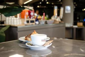 Příslušenství pro přípravu čaje a kávy v ubytování The Gate Hotel - Firenze Nord