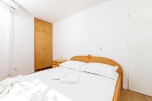 Llit o llits en una habitació de Hotel Timun