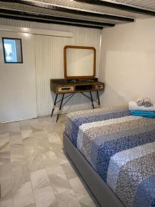 a bedroom with a bed and a tv on a table at Appartment by Eftymia in Nea Roda