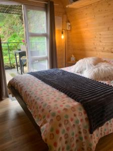 a bedroom with a bed and a window and a table at U Sognu 3128 in Muro