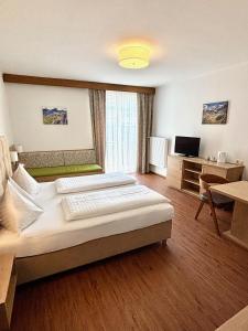 Postel nebo postele na pokoji v ubytování Haus Friedrichsburg - Bergbahnen von Mai bis November inklusive
