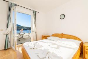 Llit o llits en una habitació de Hotel Timun