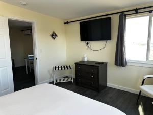 Postel nebo postele na pokoji v ubytování Dock Street Inn