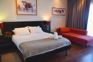 Postel nebo postele na pokoji v ubytování BergWood Inn