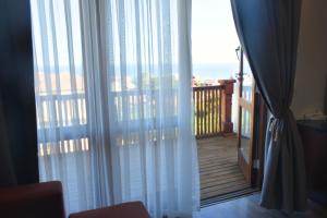 Balkón nebo terasa v ubytování BergWood Inn