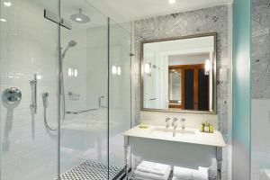 a bathroom with a sink and a shower at London Marriott Hotel County Hall in London