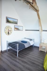 Postel nebo postele na pokoji v ubytování La Petite Ferme