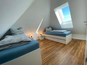 Postel nebo postele na pokoji v ubytování Ferienwohnung Scheuring 2 OG Nord