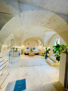 a large living room with a stone ceiling at Al Palazzotto in Fasano