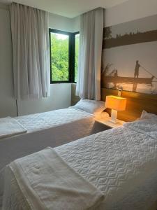 Postel nebo postele na pokoji v ubytování Resort Iloa