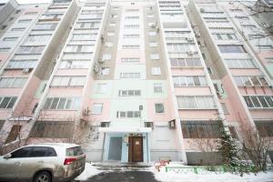 an apartment building with a door in front of it at Five Stars Monakova in Chelyabinsk