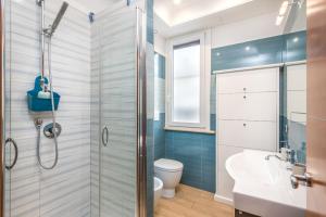 a bathroom with a shower and a toilet and a sink at Olimpic Vatican Home in Rome +38 photos