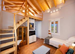 a room with a bunk bed and a ladder at Santa Marina House in Lefkada