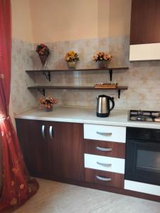 a kitchen with a stove and a counter top at THE BEST ROOMS & APARTMENTS - Parcheggia gratis sotto casa ed entra - in Mazara del Vallo +19 photos
