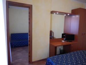 Letto o letti in una camera di Albergo Dei Leoni